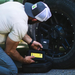 Man checking tire pressure with Lion Energy Cub JC 